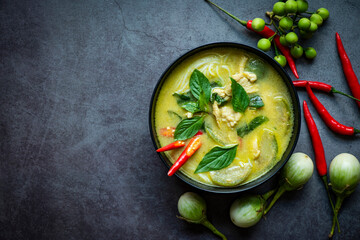 Traditional green curry chicken cuisine asian food, Chicken green curry Thai food on soup bowl with ingredient vegetable herbs and spices pepper chili. Top view - 439434538