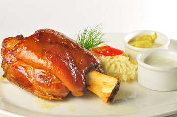 Roasted pork knuckle with fresh cabbage salad, selective focus