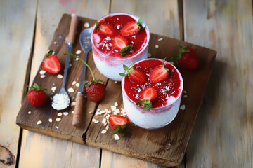 Chia yogurt in cups with strawberries and seeds. Healthly food. Keto breakfast or snack.