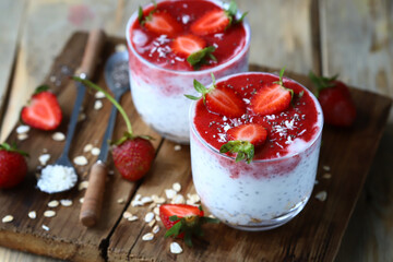 Chia yogurt in cups with strawberries and seeds. Healthly food. Keto breakfast or snack.