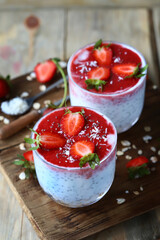 Chia yogurt in cups with strawberries and seeds. Healthly food. Keto breakfast or snack.