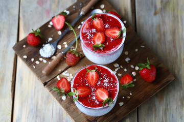 Chia yogurt in cups with strawberries and seeds. Healthly food. Keto breakfast or snack.