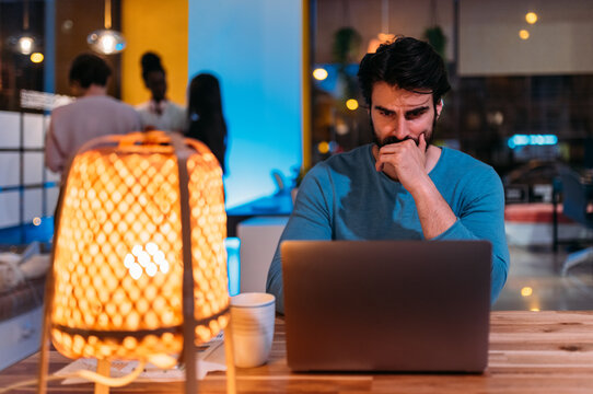 Focused male working on laptop