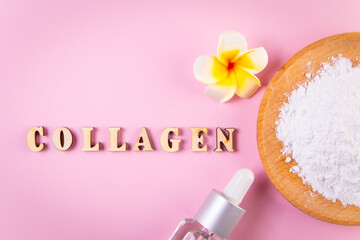 Collagen powder in wooden bowl and moisturizing cosmetic serum on pink background. Skin care, anti aging product.