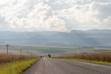 Scenic rural road with Drakensberg mountain range
