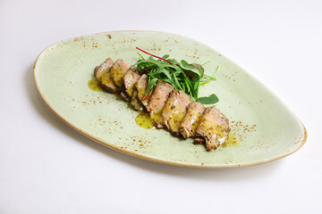 Sliced Peking Duck served with sauce, fresh salad, on white background