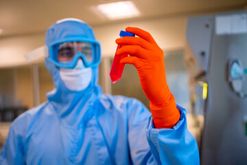 Scientific Wearing A Anti Pathogen Protective Suit. 