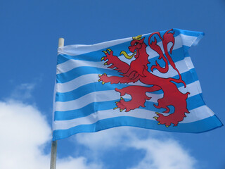 The Red Lion - civil flag and ensign of Luxembourg featuring white and blue stripes, red lion with...