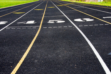 Athletic or running track with striped for lanes.