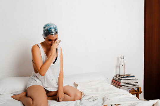 Androgyne bored model waiting in her room