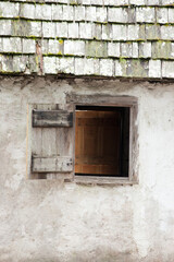 Fototapeta na wymiar An open wooden window in a building.