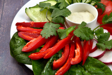 sliced vegetables on white plate closeup