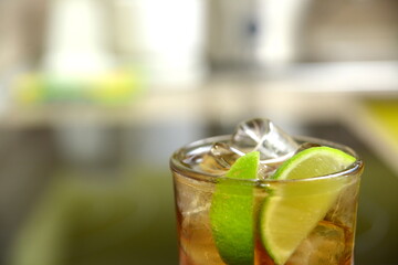 homemade cocktail on the wooden table closeup on kitchen blurred background