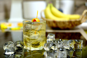 homemade cocktail on the wooden table closeup on kitchen blurred background