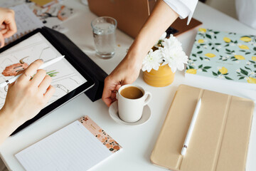 Close Up Woman Putting A Cup Of Coffee On The Desk 