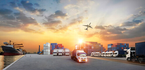 Container truck in ship port for business Logistics and transportation of Container Cargo ship and Cargo plane with working crane bridge in shipyard at sunrise, logistic import export concept