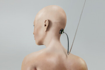 Rear view of a shaved head with a wire attached to the head