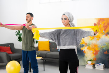 Muslim couple exercising at home