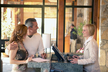 Couple checking in to hotel