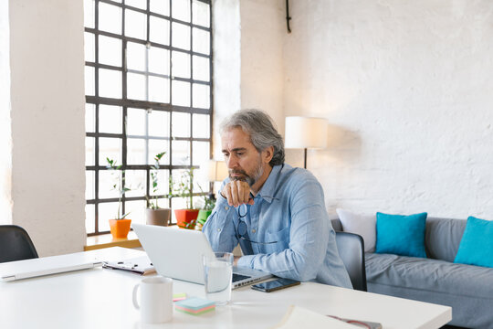 Portrait Of A Senior Businessman Working In The Office 