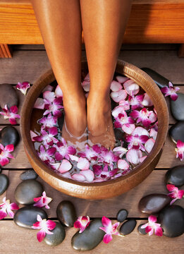 Woman soaking her feet at a spa