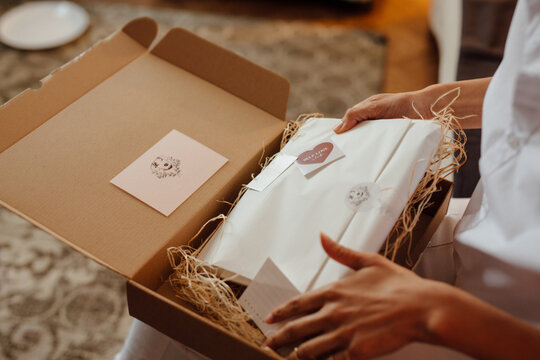 Close Up Woman Taking The Gift Out Of The Box 