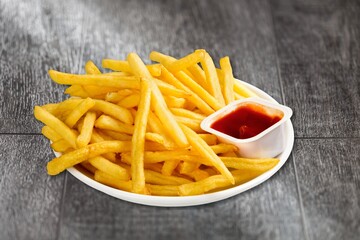 Sweet potato fries with ketchup sauce, homemade roasted in the oven