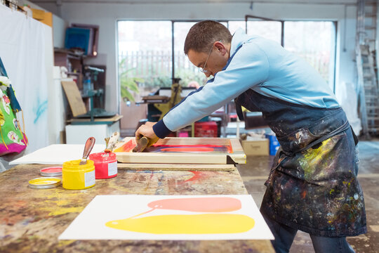 Focussed silkscreen artist at work