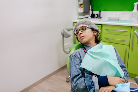 Hispanic patient of dental clinic looking away