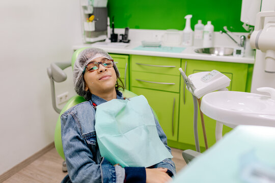 Positive Hispanic patient during appointment in dental office