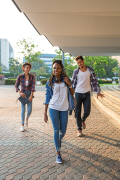 Group of friends walking together on campus site