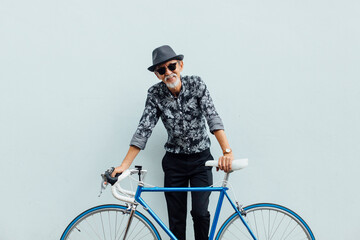 Senior asian man with road bicycle