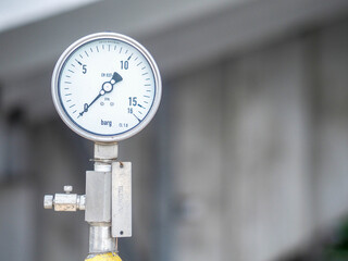 Pressure gauge of measuring instrument close up in industry zone at power plant with closed up
