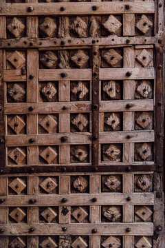 Details on a fancy wooden door in India