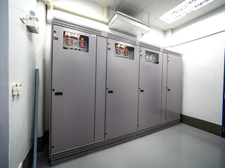 Electrical panel of inverter and battery charger systems for storage power from battery in power plant.