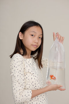 Teenager with goldfish