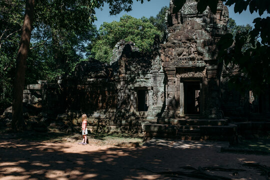 Little girl exploring Angkor Wat in Cambodia