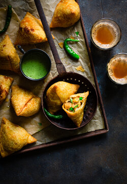 Freshly made samosas with chutney and chai