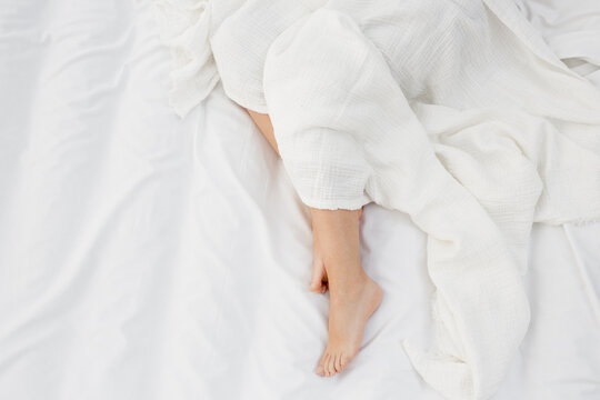 Woman feets in bed