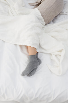 Woman feets in bed