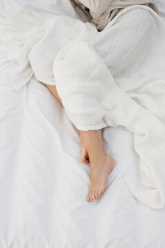 Woman feets in bed