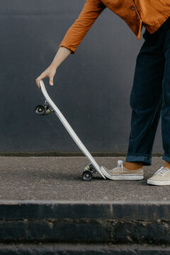 Young woman with skateboard