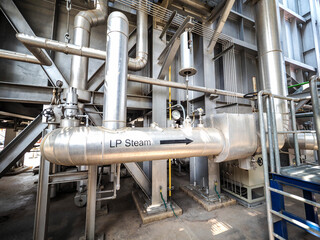Spring hanger pipe support in power plant.