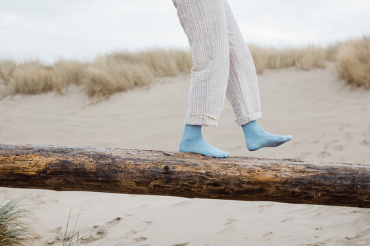 Trendy Young woman in fun blue socks 