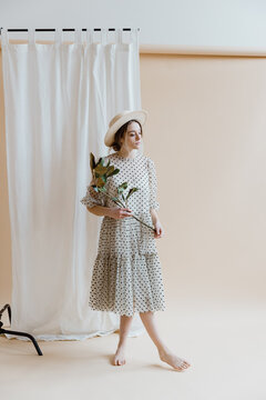 Girl in a Polka Dot Dress and Hat
