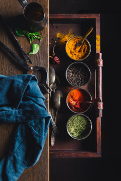Spices in a messy Indian kitchen
