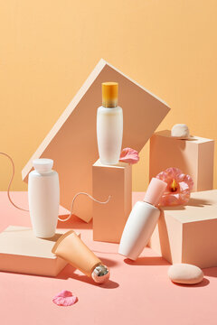 Brick on pastel background with cosmetics collection. Abstract still life