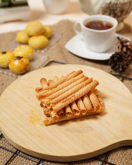 Fototapeta na wymiar The semprong cake or semprong cake has a unique shape, which is like a layered pipe or triangle. This snack has a sweet and savory taste. Cake food originating from Indonesia. Food mockups.