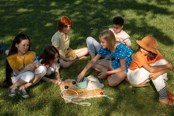 The company of stylish children in a park