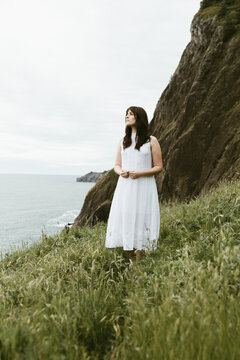 Woman in coastal field